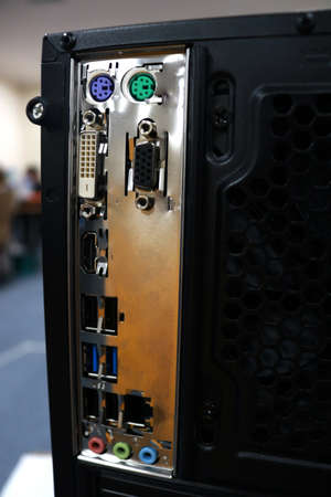 Close-up of a black computer case with different electronic components.の写真素材