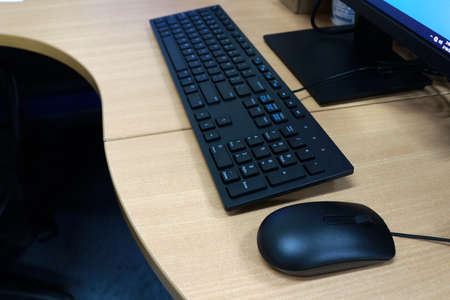 Computer mouse and keyboard on the table in a modern office. High quality photoの写真素材