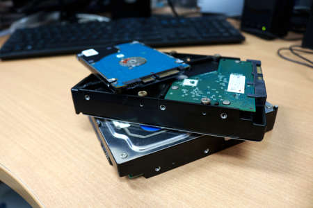 Disassembled hard drive on a table in the office. Disassembled hard drive.の写真素材