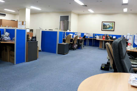 interior of a modern office with blue walls and a wooden floorの写真素材