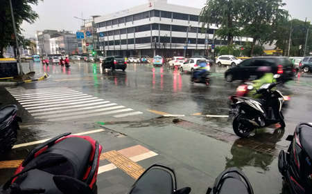 vehicles are seen crossing the street in Salvador.の写真素材