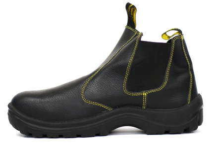 Black boot on a white background. Close-up.の写真素材