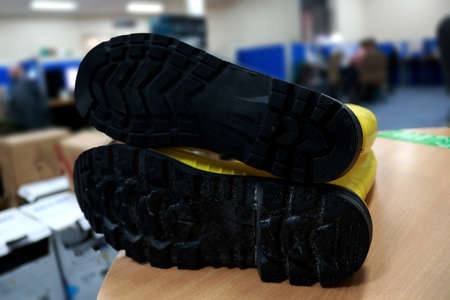 Close-up of pair of insoles on the table in the store