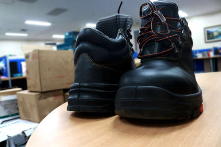 Pair of black hiking boots on the table.の写真素材