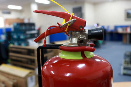 A fire extinguisher is an active fire protection device used to extinguish or control small fires, often in emergency situations. can also be called a small extinguisher for indoorの写真素材