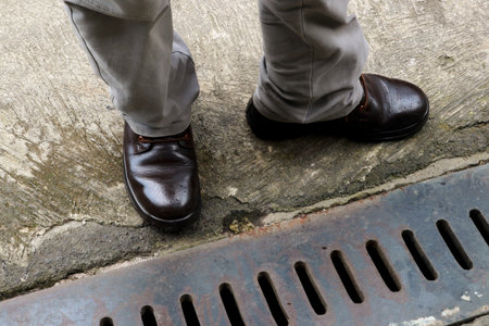 A man wearing jeans and brown leather shoesの写真素材