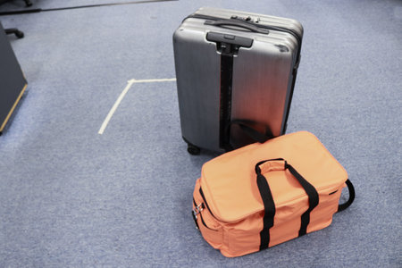 Suitcase and bag on the floor, travel conceptの写真素材