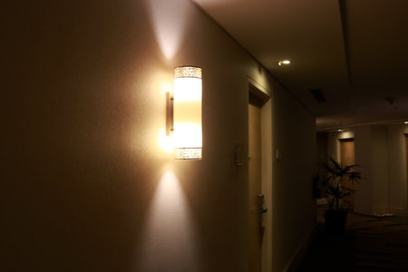 Interior of a room with a glowing light on the wallの写真素材