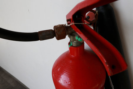A fire extinguisher is an active fire protection device used to extinguish or control small fires, often in emergency situations. can also be called a small extinguisher for indoorの写真素材