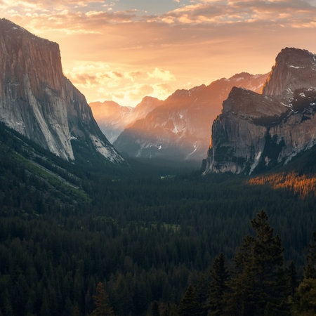 Breathtaking sunrise over a majestic mountain valley with golden light illuminating rugged cliffs and lush pine forests. Perfect for travel blogs, nature posters, environmental campaigns, and adventure-themed designs capturing the beauty of wilderness and tranquility.の素材