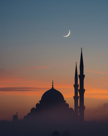 Serene twilight landscape featuring the outline of Islamic architecture. The high contrast between the dark mosque and the colorful dusk sky creates a spiritual atmosphere perfect for religious greeting cards.の素材