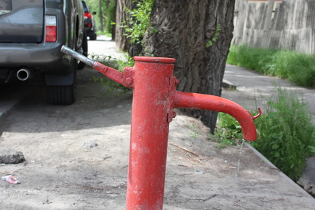An old water pump, with closeup of the faucet and handle.の写真素材