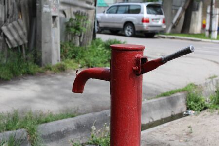 An old water pump, with closeup of the faucet and handle.の写真素材