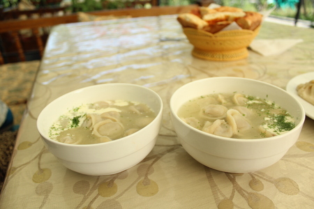 Meat dumplings with crushed herbs on top.の写真素材