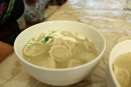 Meat dumplings with crushed herbs on top.の写真素材