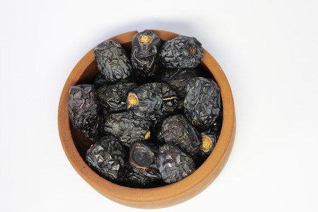 Dried dates. Beautiful bowl full of date fruits symbolizing Ramadanの写真素材