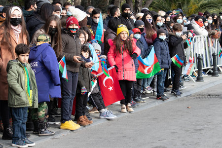 Children coming to the military parade with flags in their hands. Azerbaijan and Turkey are brothers. Baku-Azerbaijan: 10 December 2020.のeditorial素材