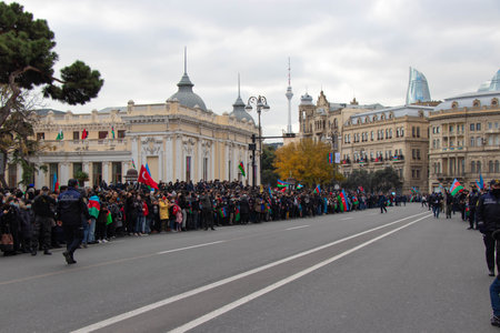 Baku - Azerbaijan: 10 December 2020. People waiting for the soldiers victory parade. Turkish and Azerbaijan flags on handsのeditorial素材