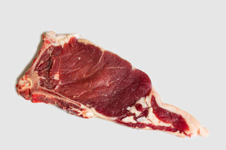Fresh raw beef steak. Close-up raw rib eye steak isolated on white backgroundの写真素材