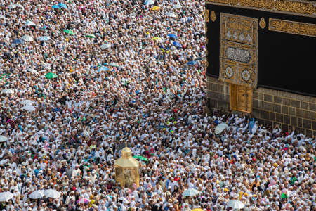 Holy Kaaba and Magam Ibrahim in Mecca. Muslim pilgrims during tawaf. Mecca - Saudi Arabia: August...