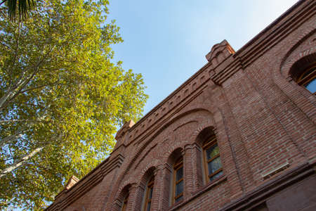 Brick building with windows on sky background. Ugurlu Khan Caravanserai in Ganja city of Azerbaijan