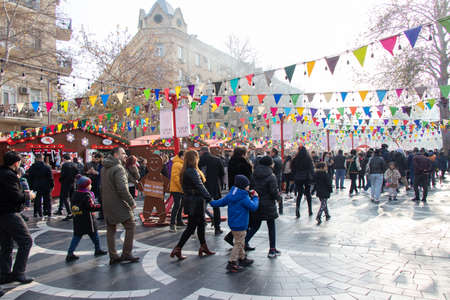 Happy people celebrating the holiday. Christmas day in the central street of Baku - Azerbaijan: 31 December 2021のeditorial素材