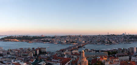 Sunset in Istanbul. Aerial panoramic view of Bosporus with Topkapi Palace, Hagia Sophia, and Blue Mosque seen from Galata Tower.の写真素材