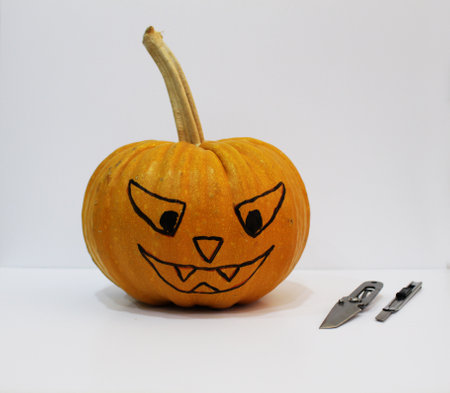 Pumpkin and knives for making Jack-olantern for Halloween. Making halloween pumpkin.の写真素材