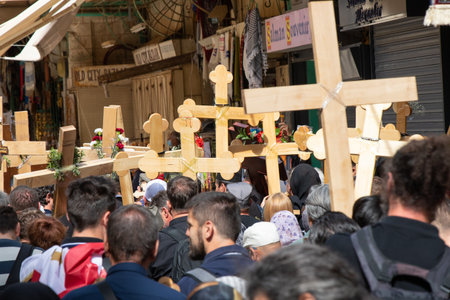 Jerusalem - April 22, 2022: Christian pilgrims commemorate the path Jesus carried his cross on the day of his crucifixion along the Via Dolorosaのeditorial素材