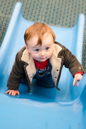 Young boy playing in playgroundの写真素材