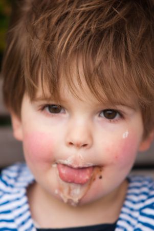 Children sitting in park eating ice-creamの写真素材