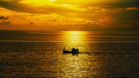Fishing boat in the sea at sunset. Fishing boat in the sea.の写真素材