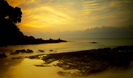 Tropical beach at sunset. Nature composition and vibrant colors.の写真素材
