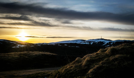 Beautiful winter landscape in Iceland. Dramatic sunset over the mountains.