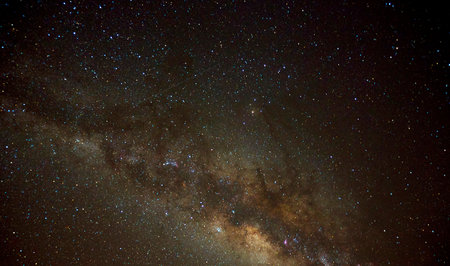 Milky way galaxy with stars and space dust in the universe, Long exposure photograph, with grain