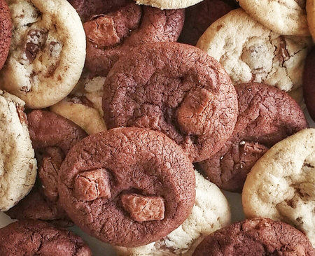 Chocolate chip cookies as a background. Top view. Toned.