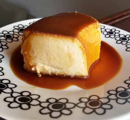 Creamy caramel pudding on a plate, close-up.の写真素材
