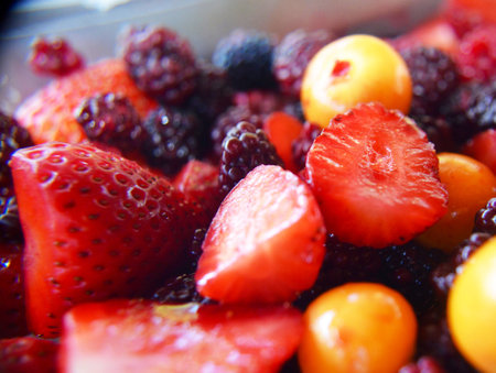 Close up of fresh berries in a plastic container, shallow depth of field