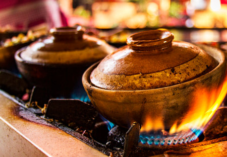 Ceramic pots on the gas stove, Thailand.の写真素材