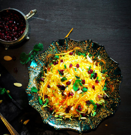 Rice pilaf with cranberries and nuts on dark wooden backgroundの写真素材