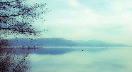 Lake and mountain in the morning, vintage color tone, soft focusの写真素材