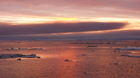 Icebergs in the sea at sunset, Antarctic Peninsula, Antarcticaの写真素材