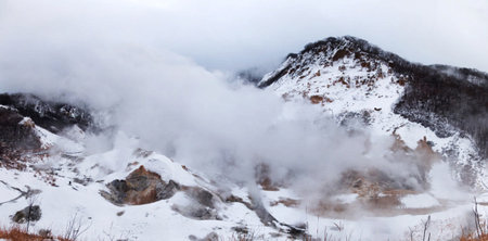 Mountains and fog in winter, Yading national level reserve, Daocheng, Sichuan Province, Chinaの写真素材