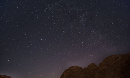 night sky with stars and milky way over the mountains in Egyptの写真素材