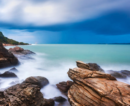 Seascape with stormy sky and rocks. Nature composition.