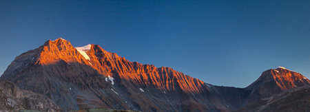Panoramic view of mountain peaks at sunrise