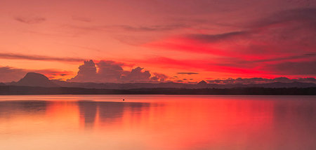 Sunset at the lake in the evening. Landscape of the lake.