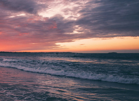 Beautiful sunset on the beach. Colorful sky and clouds.の写真素材