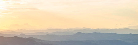 panorama of mountain range and blue sky at sunsetの写真素材