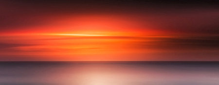 Beautiful sunset over the sea. Panoramic photo. Long exposureの写真素材